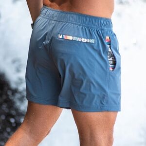 WOWIE NOMAD SHORTS TRUNKS LINED AZTEC PRINT MAGNETIC POCKETS 7” SZ MEDIUM BLUE